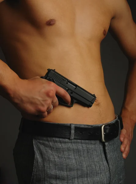 Man torso with gun in hands
