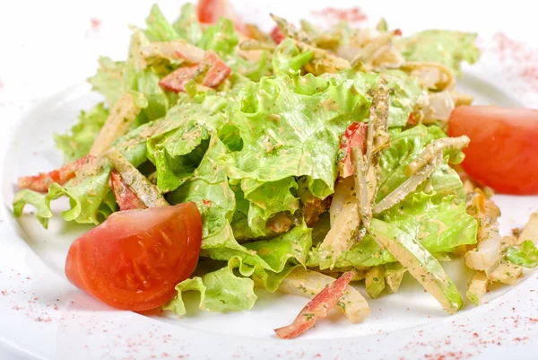Salad of squid with roast chicken meat, apples, tomatoes, eggs and ...