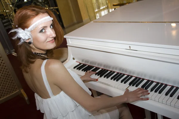 Retro woman playing the piano