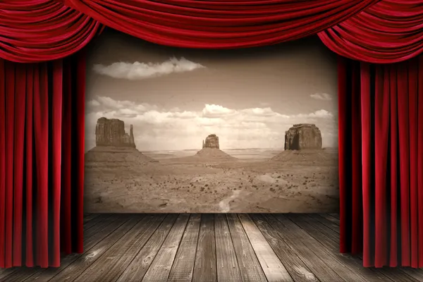 Red Theater Curtain Drapes With Desert Mountain Background