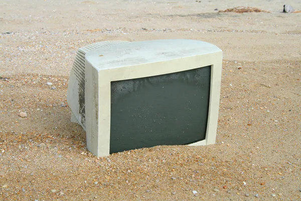Old monitor on the beach