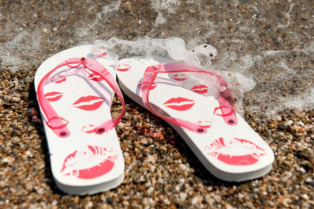 Female flip flops at the beach — Stock Photo © ivonnewierink #3515655