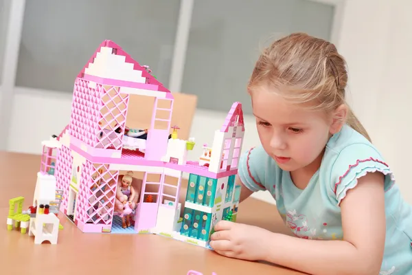 Playing with doll\'s house