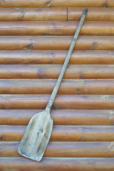 Old wooden baker's shovel on wall