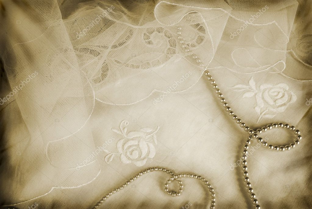 Romantic grunge wedding arrangement with pearls on vintage veils