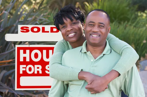 African American Couple Sold Sign
