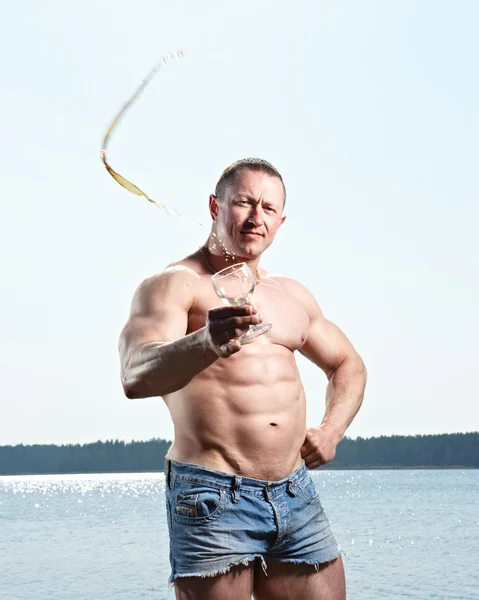 dep_2890357-Muscular-man-with-glass.jpg