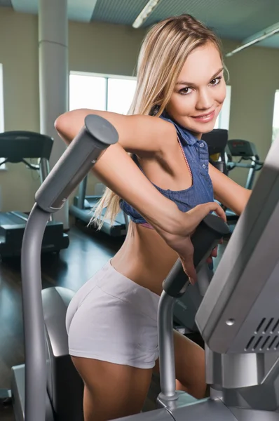 Beautiful blond girl at the gym