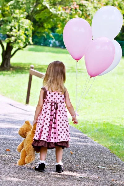 Child With Balloons and Teddy Bear