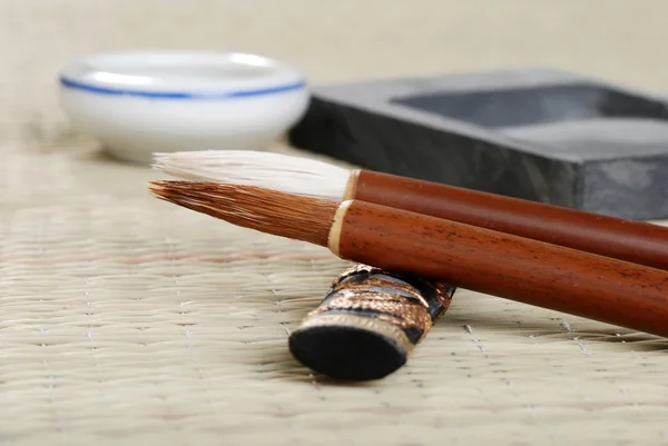 Macro asian calligraphy brush with accessories
