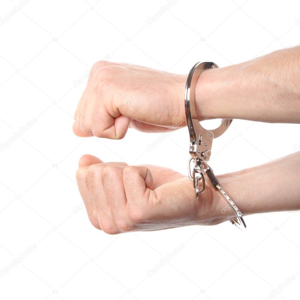 Hand wearing handcuffs — Stock Photo © Viviamo 3623752