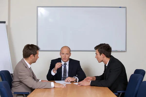 Businessmen in meeting at board room