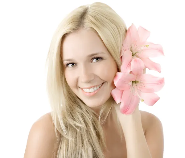 Beautiful young blonde woman with lily flower smile isolated by Irina Pussep