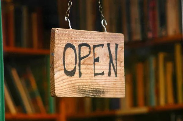 Retail image of open book shop sign