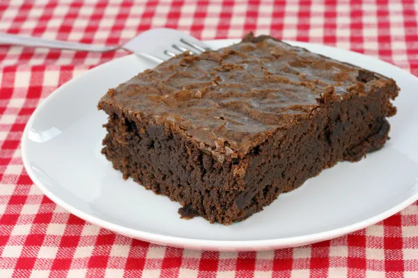 Fudge brownie on white plate