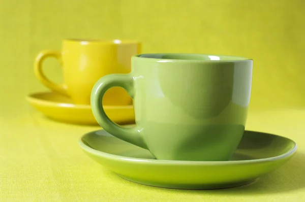 Yellow and green cups of coffee