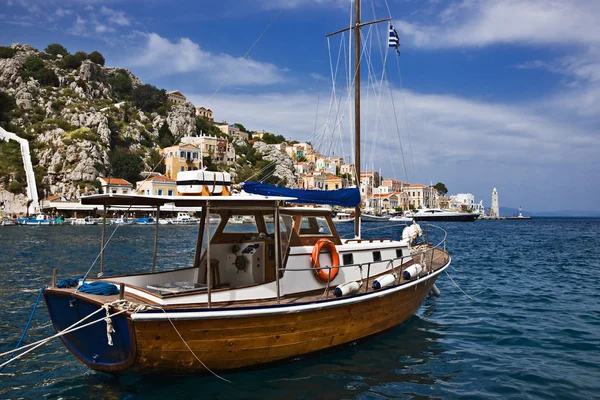 Boat in harbor of Symi, Greece