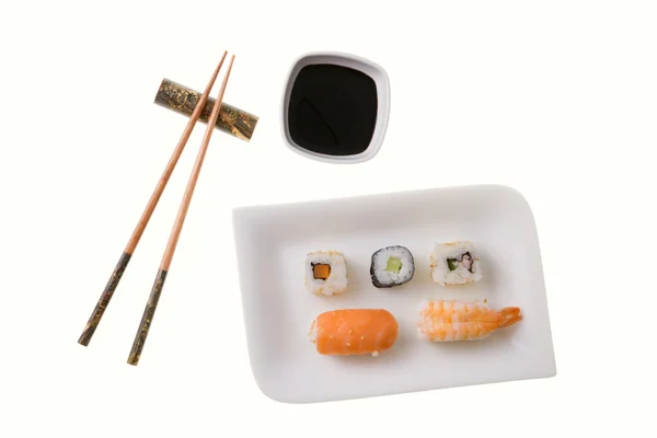 Five sushi rolls and chopsticks