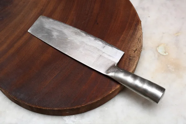 Kitchen knife on cutting board