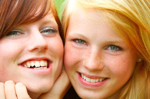 Two young teens Closeup by Yuri Arcurs Stock Photo Editorial Use Only