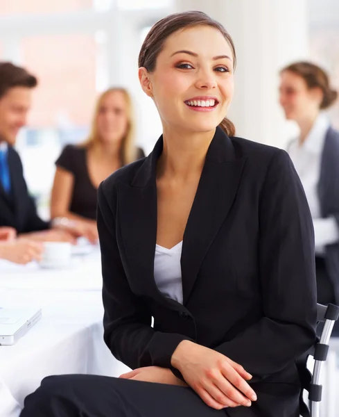 dep_3299374-Happy-young-beautiful-business-woman-in-a-meeting.jpg