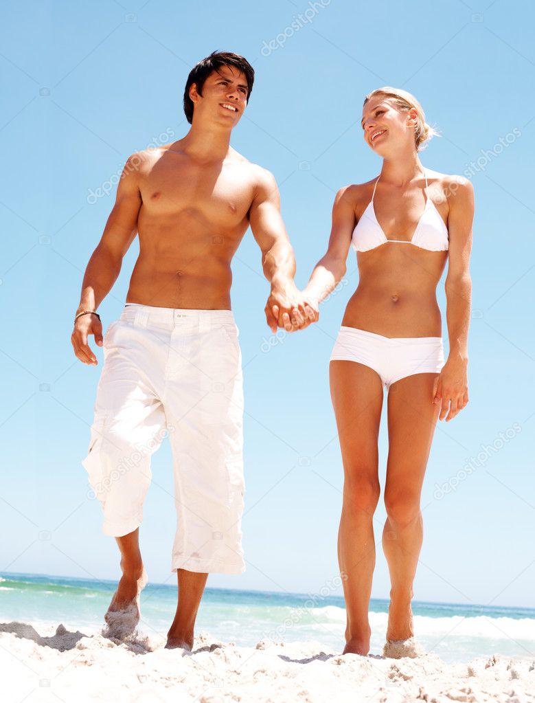 depositphotos_3324409-Portrait-of-a-happy-couple-holding-hands-and-walking-on-the-shor.jpg