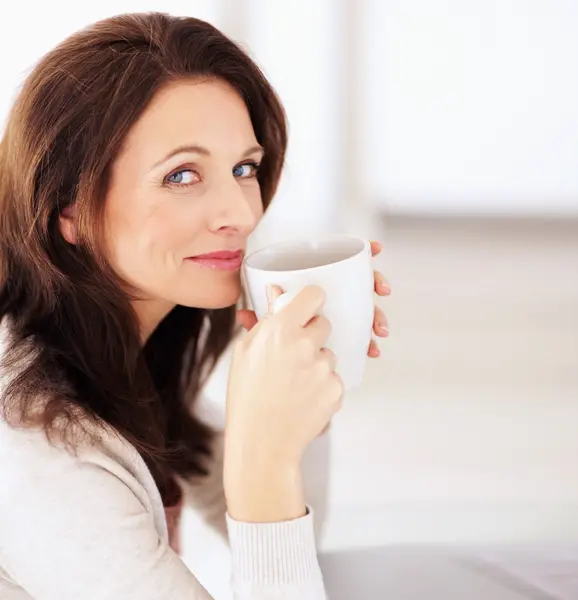 woman sipping coffee