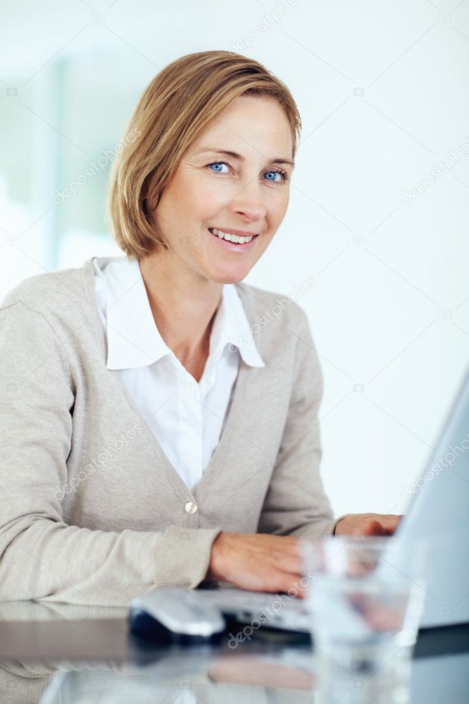 Portrait of beautiful middle aged businesswoman working on laptop Indoors depositphotos 3364347 Portrait of beautiful mature woman with laptop at office Portrait of beautiful middle aged businesswoman working on laptop Indoors