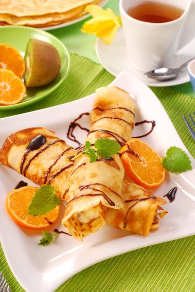Rolled pancakes with cottage cheese