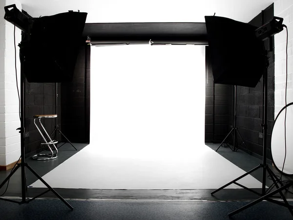 Empty studio with lights and white backg