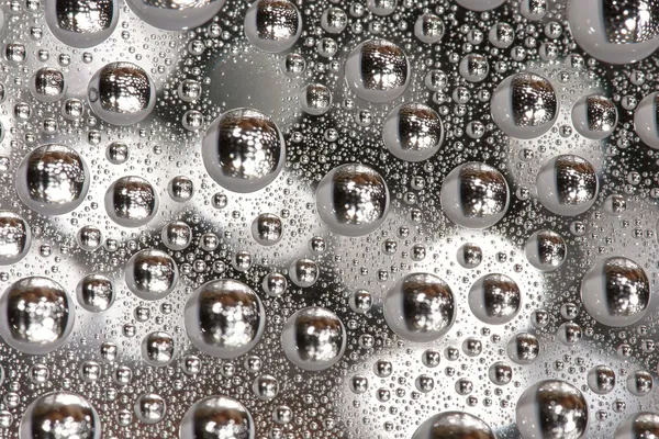 Water drops on a silver background