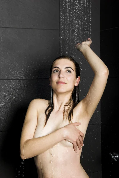 Woman in shower by Erik Reis Stock Photo Editorial Use Only