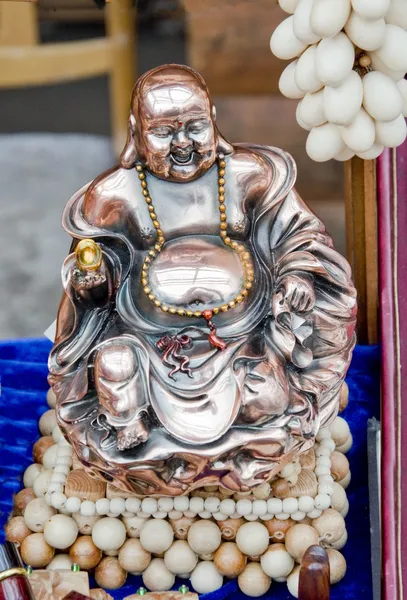 Figurine Cheerful Hotei. Chinese God of Wealth.