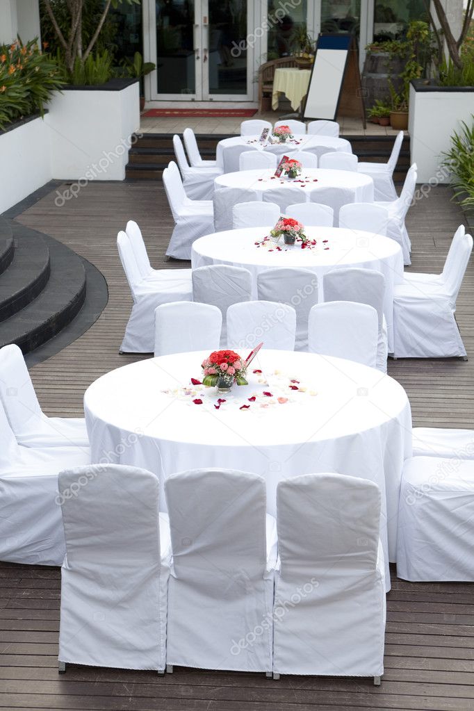 Wedding banquet tables and chairs with flower decoration