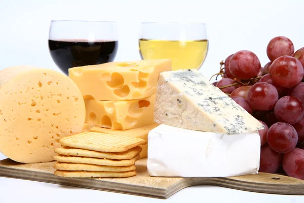 Types of cheese, wine, grapes, crackers