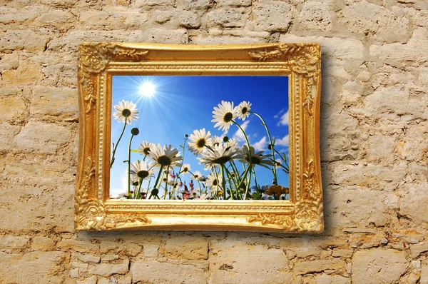 Flowers and image frame on wall