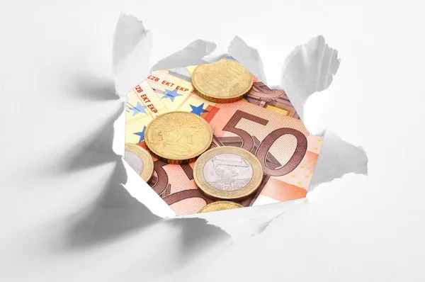 Euro money behind hole in paper