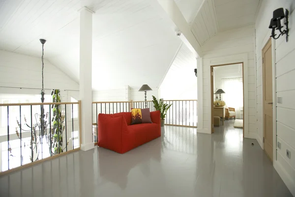 Hall in the house with red sofa