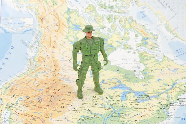 Toy soldier on world map