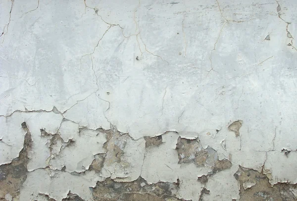 Worn white wall damaged paint