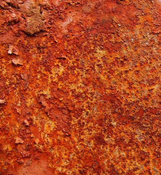 Very rusty plate of red orange metal