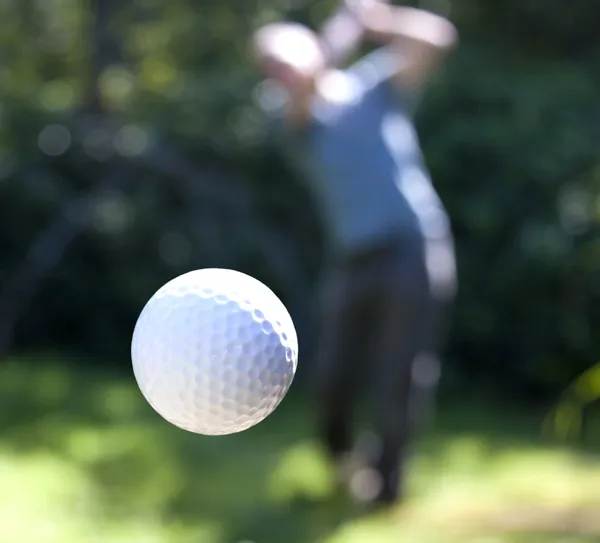 A golf ball in flight