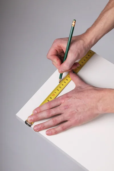 Hands with measurement tool