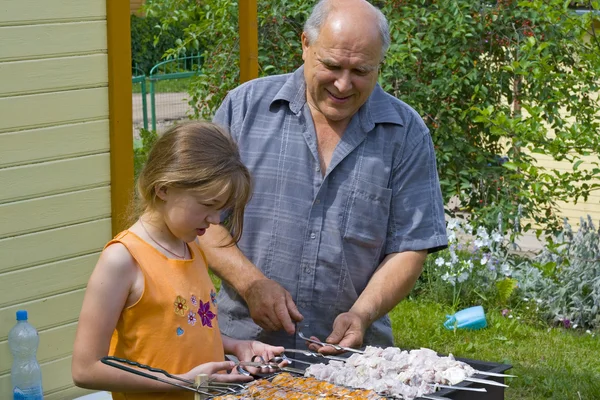 Grandfather, granddaughter and kebab