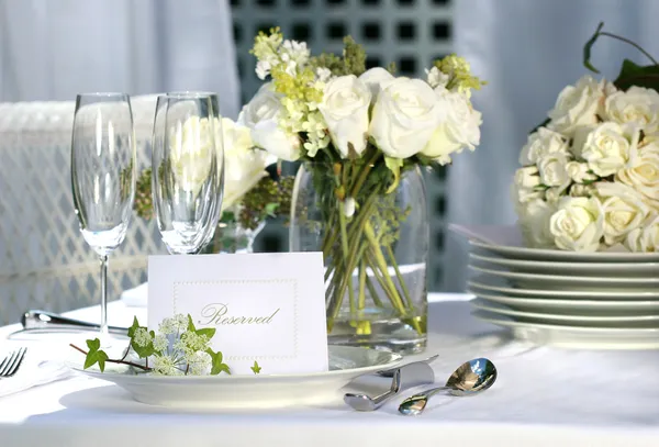 White place card on outdoor wedding table by Sandra Cunningham Stock Photo