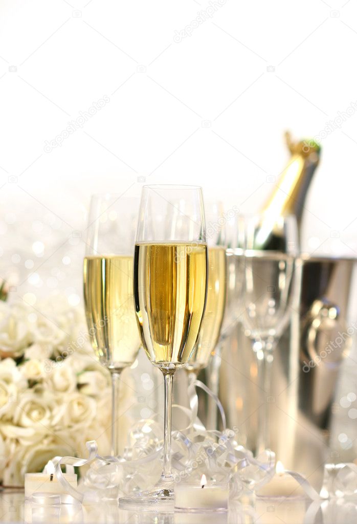 Glasses of champagne for a wedding reception on white background