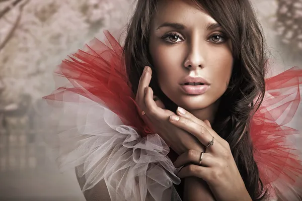 Fashion type portrait of a young beauty brunette
