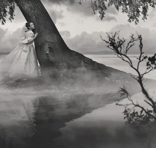 Fine art photo of a woman in beauty scenery in black and white