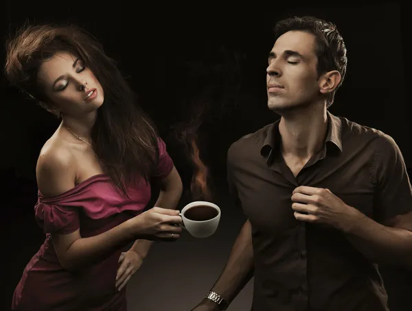 Sexy couple with cup of coffee