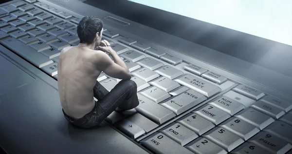 Conceptual photo of a young man addicted to the internet